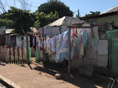 07A Ramshackle house on 2nd Street with clothes drying on the sidewalk Trench Town Kingston Jamaica